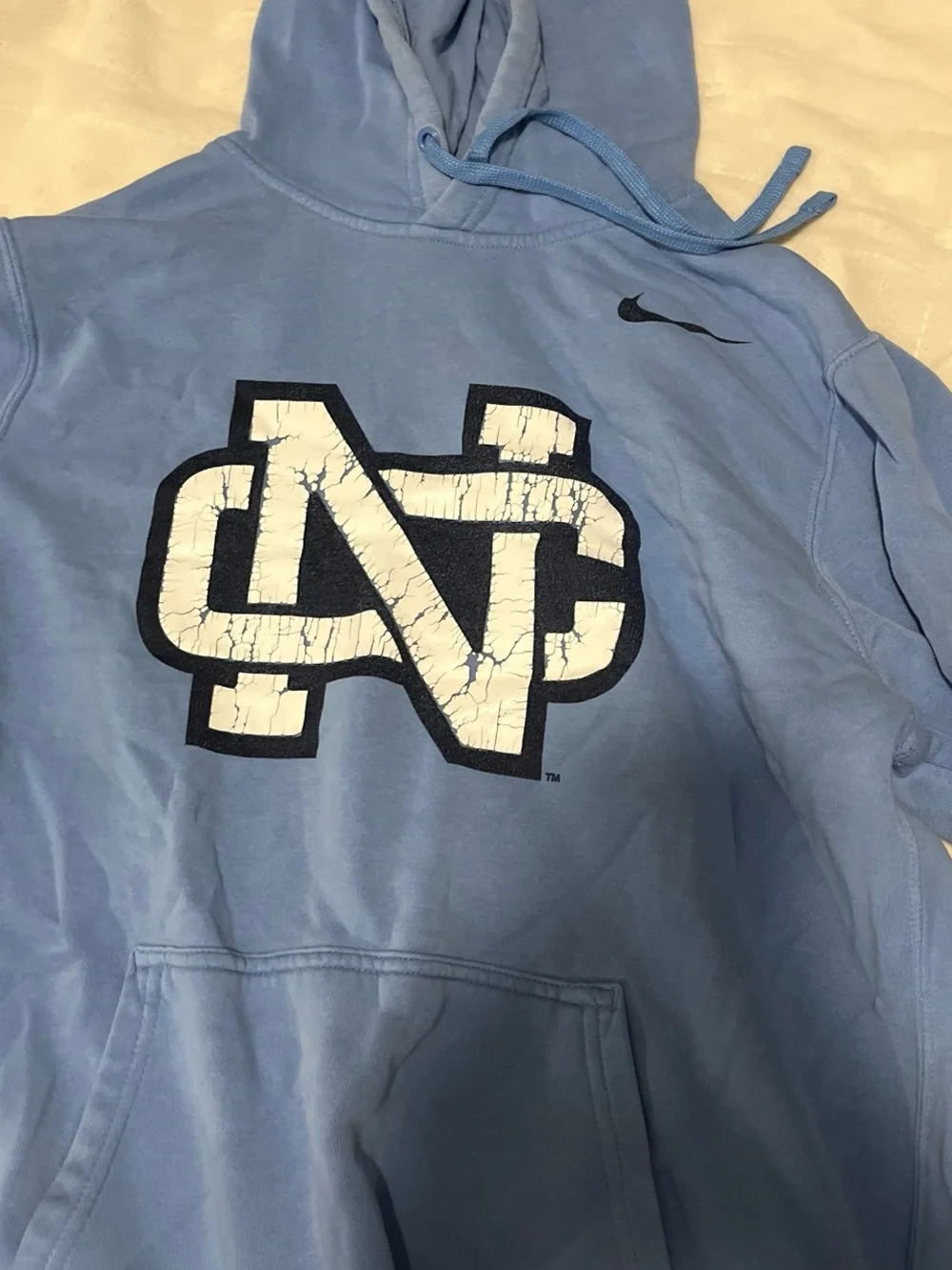 Nike Light Blue Hoodie with White Cracked Logo and Black Outline